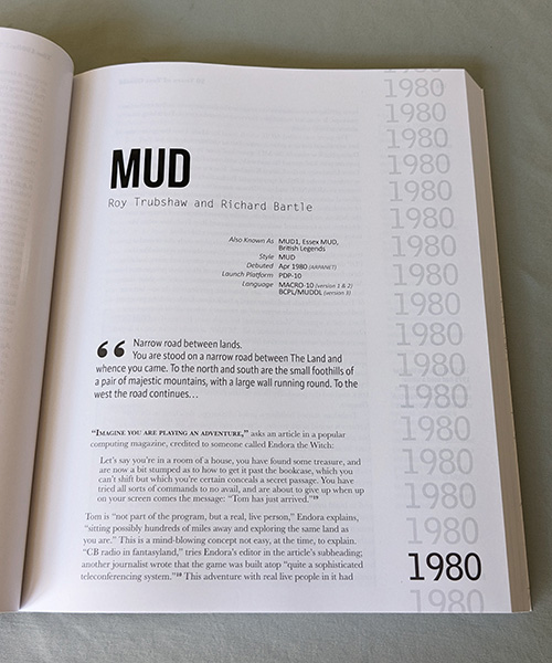 A page from the book showing the chapter header on the 1980 game MUD, with a stats block showing launch platform and other details, and a  blockquote with the opening text of the game, which begins: 'You are stood on a narrow road between The Land and whence you came.'